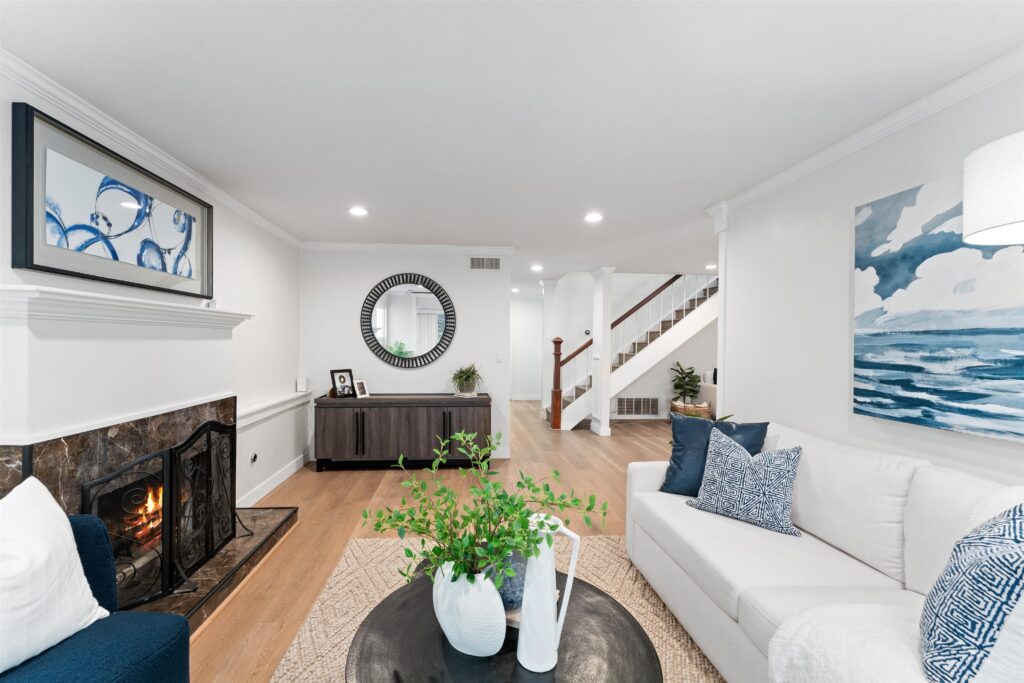 Home Staging Orange County: Professional Staging Services That Help Homes Sell Faster 2 A spacious living room with blue and white furniture, emphasizing a fresh and contemporary aesthetic.