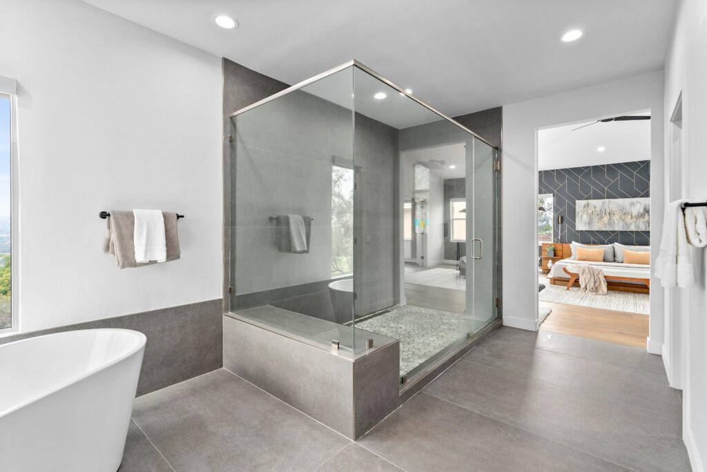 Home Staging Companies: How Professional Staging Helps Homes Sell Faster 1 A modern bathroom featuring a spacious walk-in shower with sleek fixtures and contemporary design elements, Home Staging Companies